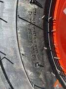 (4) Unused 12-16.5 skid steer tires on wheels for Bobcat