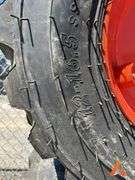 (4) Unused 12-16.5 skid steer tires on wheels for Bobcat
