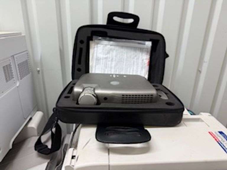 Copiers, paper feeder, scanners, projector, small office items, large wooden storage shelf, small de