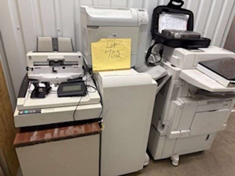 Copiers, paper feeder, scanners, projector, small office items, large wooden storage shelf, small de