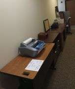 4 office desks, laminator, 4 drawer filing cabinet, office chair, miscellaneous office items