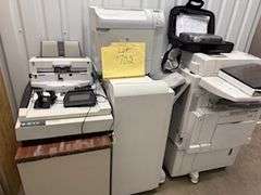 Copiers, paper feeder, scanners, projector, small office items, large wooden storage shelf, small de
