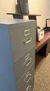 4 office desks, laminator, 4 drawer filing cabinet, office chair, miscellaneous office items