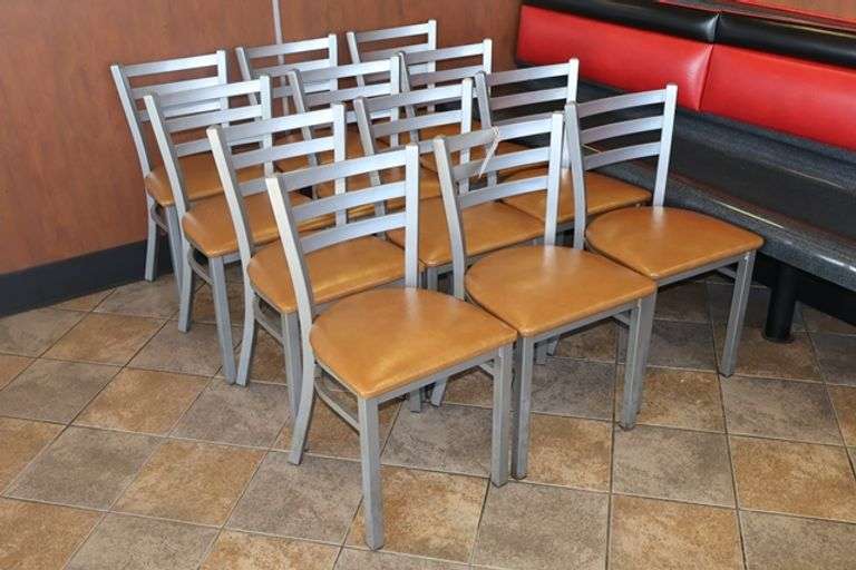 Times 12 - Silver metal framed ladder back dining chairs with brown vinyl padded seats