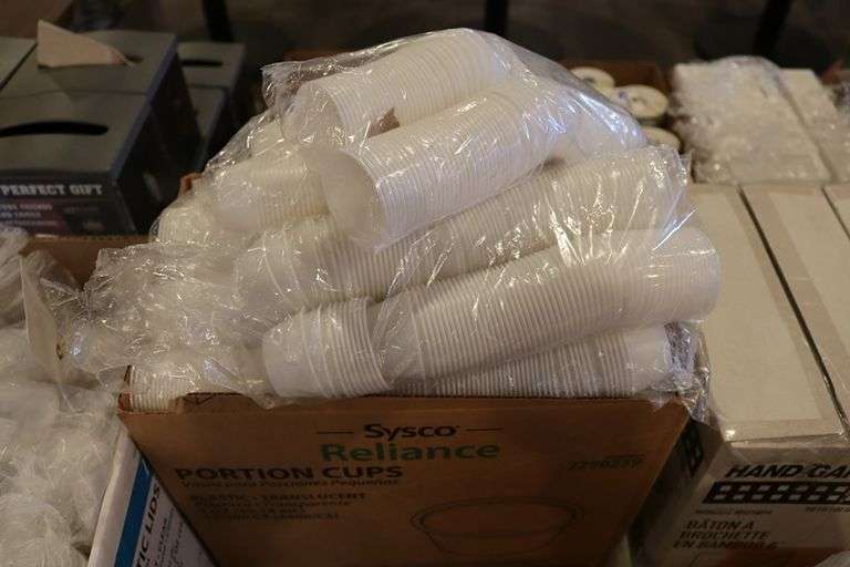 Case of Sysco 2 oz. portion cups with 2 cases of lids