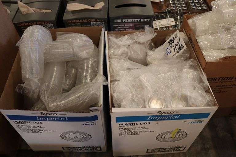 Case of Sysco 2 oz. portion cups with 2 cases of lids
