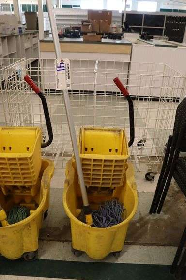 Yellow mop bucket with mop