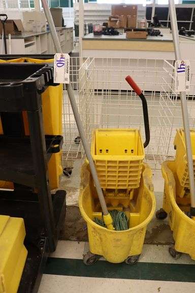 Yellow mop bucket with mop
