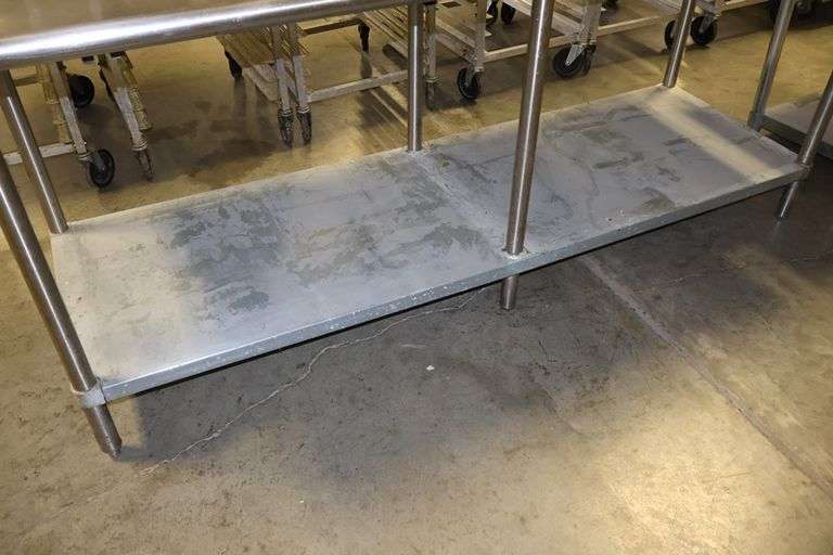 30" x 84" Stainless table with galvanized under shelf and Cozzini can opener