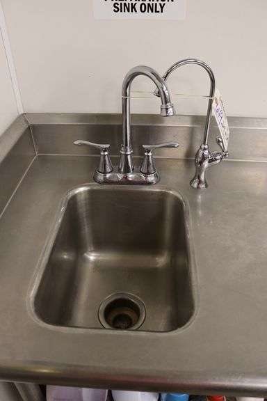 24" x 54" stainless table with 1 bin sink with 3 sided 4" back splash