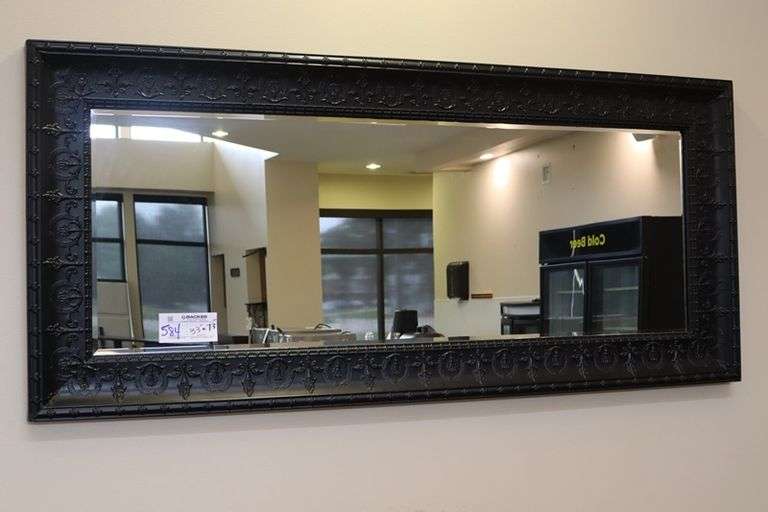 Ornate tin framed 33" x 72" beveled edge mirror