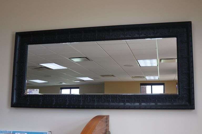 Ornate tin framed 33" x 72" beveled edge mirror