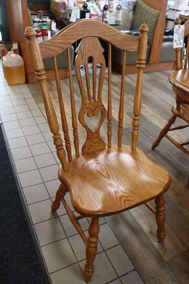 Oak 40" x 84" dining room table with 6 matching solid oak ornate chairs