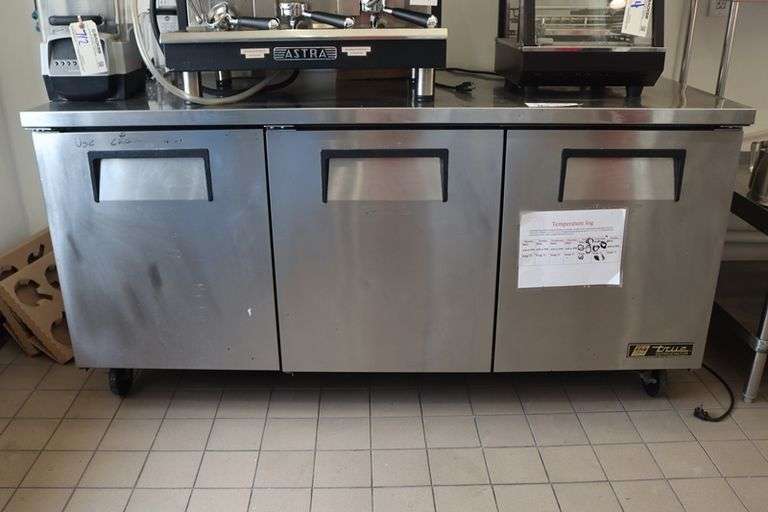 True TUC-72 stainless refrigerated 3 door under counter cooler with stainless work top