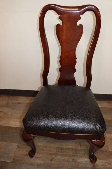 Ornate and elegant 45" x 114" long dining room table with 8 chairs (2 are captains chairs) with heavy black decorative vinyl padded seats
