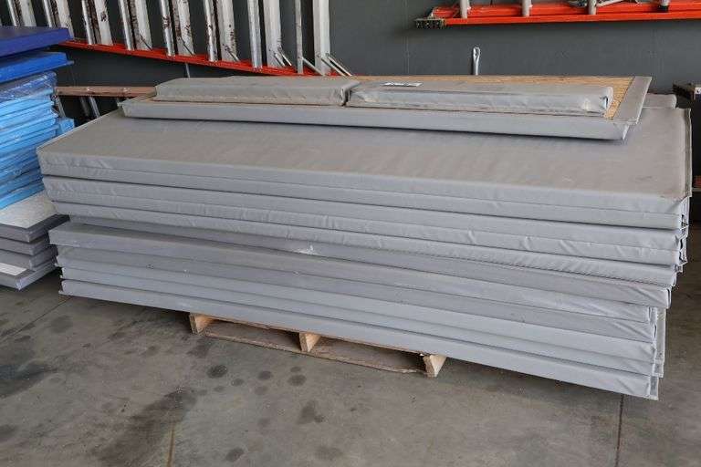 Pallet of 2.5" thick grey gym wall padding - 96" tall with a door pad
