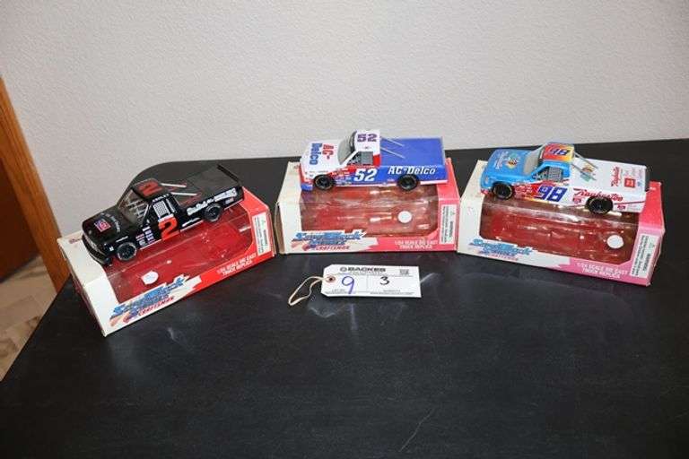 All to go - 3 Nascar 1/24 scale die cast trucks - Located upstairs