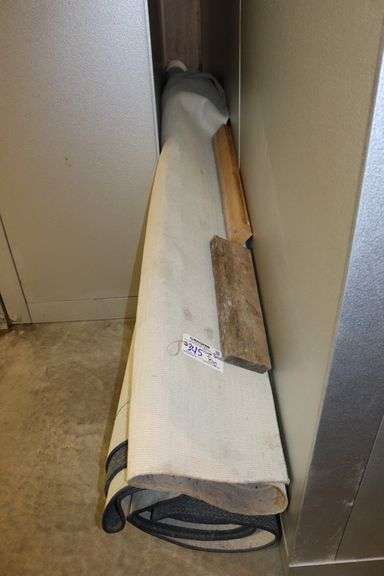 Huge rolled up former bank rug - unknown size