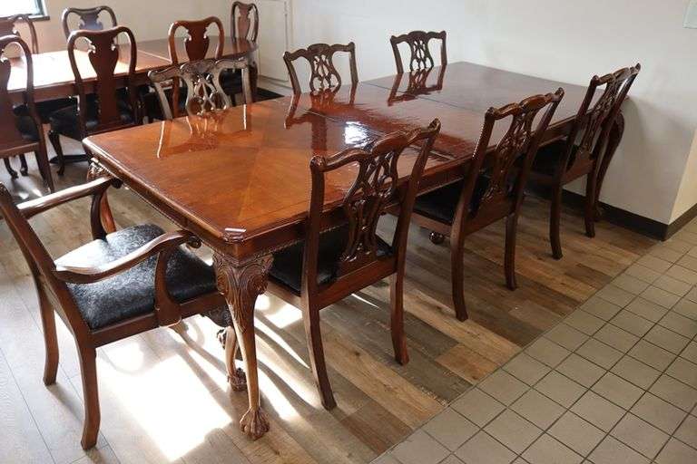Orante and elegant 46" x 100" long dining room table with 8 chairs (2 are captains chairs) with heavy black decorative vinyl padded seats