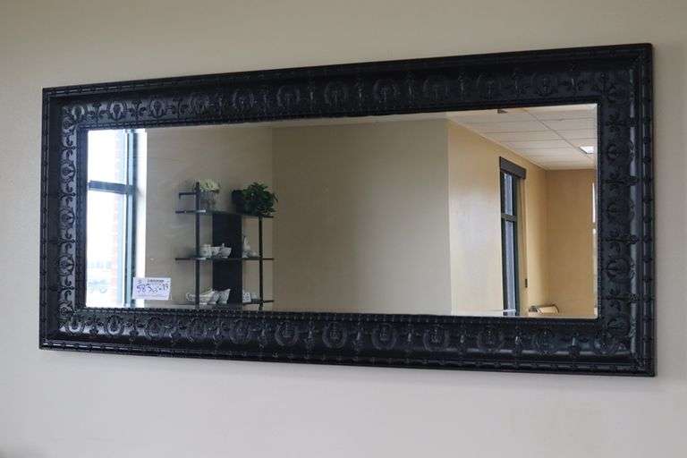 Ornate tin framed 33" x 72" beveled edge mirror