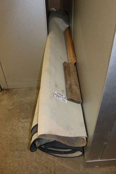 Huge rolled up former bank rug - unknown size