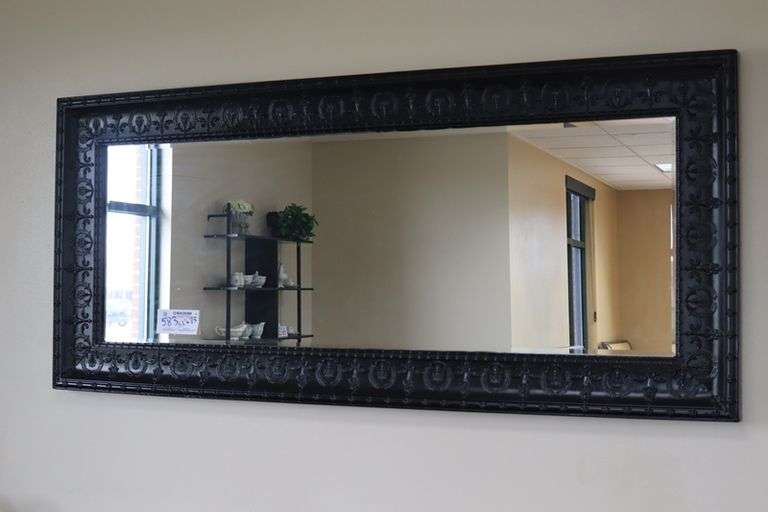 Ornate tin framed 33" x 72" beveled edge mirror