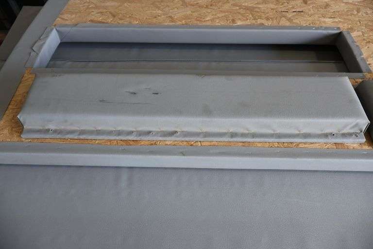 Pallet of 2.5" thick grey gym wall padding - 96" tall with a door pad