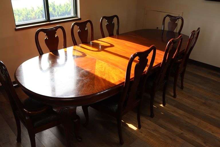 Ornate and elegant 45" x 114" long dining room table with 8 chairs (2 are captains chairs) with heavy black decorative vinyl padded seats