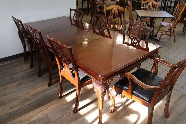 Orante and elegant 46" x 100" long dining room table with 8 chairs (2 are captains chairs) with heavy black decorative vinyl padded seats