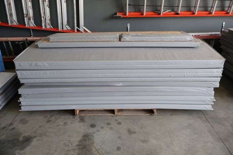 Pallet of 2.5" thick grey gym wall padding - 96" tall with a door pad