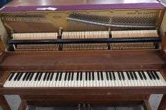 Baldwin 57" wood upright piano with bench