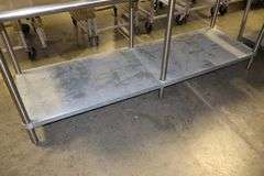 30" x 84" Stainless table with galvanized under shelf and Cozzini can opener