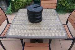 Patio set - 36" x 36" Grosfilex patio table with 4 chairs and umbrella and weights