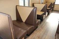 Times 4 - 4 passenger, brown and tan vinyl padded backs and seats booth openings with wall mount tables - very nice heavy duty booths