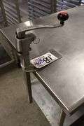 30" x 84" Stainless table with galvanized under shelf and Cozzini can opener