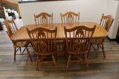 Oak 40" x 84" dining room table with 6 matching solid oak ornate chairs