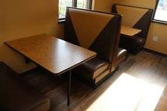 Times 4 - 4 passenger, brown and tan vinyl padded backs and seats booth openings with wall mount tables - very nice heavy duty booths