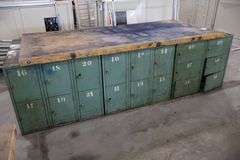 45" x 96" x 2" Thick shop table with 36 bay locker metal base cabinet