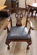 Orante and elegant 46" x 100" long dining room table with 8 chairs (2 are captains chairs) with heavy black decorative vinyl padded seats
