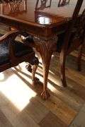 Orante and elegant 46" x 100" long dining room table with 8 chairs (2 are captains chairs) with heavy black decorative vinyl padded seats