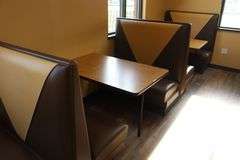 Times 4 - 4 passenger, brown and tan vinyl padded backs and seats booth openings with wall mount tables - very nice heavy duty booths