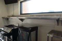12" x 120" stainless wall shelf by Sherman