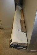 Huge rolled up former bank rug - unknown size