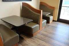 Times 3 - solid oak framed 4 passenger booth openings with vinyl padded backs and seats with single pedestal tables