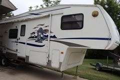 2005 Keystone RV Co. Cougar 8' x 34' fifth wheel pull behind camper with slide out side - good tires, electrical hook up, - buyer to view - Vin: 4YDF314205B06896