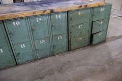 45" x 96" x 2" Thick shop table with 36 bay locker metal base cabinet