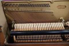 Baldwin 57" wood upright piano with bench
