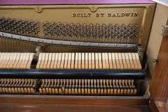 Baldwin 57" wood upright piano with bench