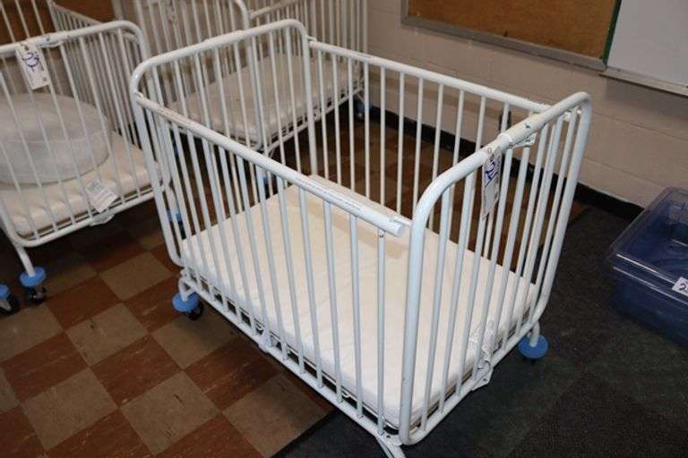 L.A. Baby white metal 2' x 3' portable baby crib with mattress