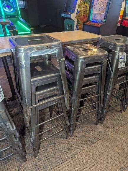 Times 4 - 24" tall silver metal bistro style stools - showing some rust - buyer to view